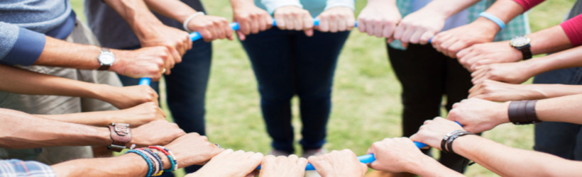 Hands holding a hula hoop